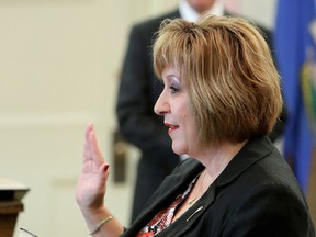 Heather Klimchuk is sworn-in as the Minister of Human Services at Government House, in Edmonton Alta., on Monday Sept. 15, 2014. David Bloom/Edmonton Sun/QMI Agency