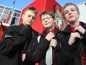 Nepean Raiders Major PeeWee B (black) players Skyler Sicoli, Jake Calder and Ryan Papp tighten up their ties outside the Bell SensPlex in Kanata Sunday, Dec. 28, 2014 following an exhibition game against a team from Finland. The boys all agree with Don Cherry and expect their Sens idols to dress smart before every game -- just like they do.
DOUG HEMPSTEAD/Ottawa Sun/QMI AGENCY