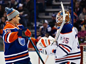 Nail Yakupov (10) laughs with goalie Viktor Fasth (35) during the Edmonton Oilers Skills Competition at Rexall Place in Edmonton on Sunday, Dec. 28, 2014. (CODIE MCLACHLAN/Edmonton Sun)