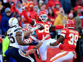 Chiefs defensive back Kurt Coleman (27) intercepts a pass against the Chargers in Kansas City yesterday. The Chiefs won 19-7. (afp)
