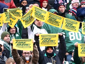 New York Jets fans wave towels asking the dismissal of general manager John Idzik during their game against the New England Patriots in East Rutherford, N.J., in this file photo taken December 21, 2014. (REUTERS/Brad Penner-USA TODAY Sports/Files)