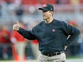 San Francisco 49ers coach Jim Harbaugh reacts to fans before a game against the San Diego Chargers at Levi's Stadium. (Bob Stanton-USA TODAY Sports)