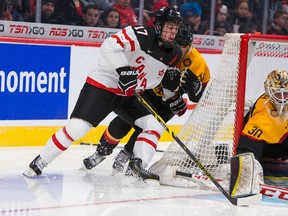 Connor McDavid skates with the puck during world junior play against Germany December 27, 2014 at the Bell Centre in Montreal. (JOHANY JUTRAS /QMI Agency)