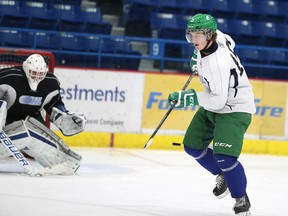 Sudbury Wolves forward Michael Pezzetta tries to redirect the puck in front of Wolves goalie Samuel Tanguay during team practice on Monday afternoon.