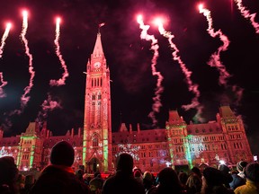 Parliament Hill kicked off the holiday season by lighting up the Centre Block with a light show, Dec. 3, 2104. (​DANI-ELLE DUBE/QMI Agency)