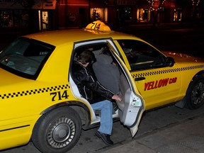 Man getting into cab on an Edmonton street. Photo Courtesy/City of Edmonton