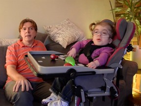 Graham Baxter, left, speaks about his daughter Eloise's rare illness in an interview with Le Journal de Montreal. (Journal de Montreal video screengrab)