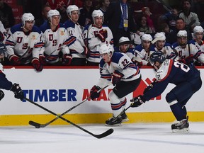 American Hudson Fasching races into the Slovakia zone during the second period of a 2015 IIHF World Junior Championship game at the Bell Centre in Montreal on December 29th, 2014. (MICHEL DESBIENS/QMI AGENCY)