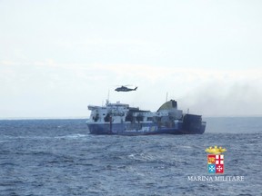 The car ferry Norman Atlantic is pictured on the way to Brindisi harbour after it caught fire in waters off Greece December 29, 2014 in this handout photo provided by Marina Militare. REUTERS/Marina Militare/Handout via Reuters
