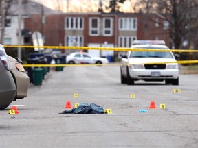 Evidence markers outside the House of Lancaster, where a man in his 20s was critically wounded in a shooting early Dec. 30, 2014. (ERNEST DOROSZUK/Toronto Sun)