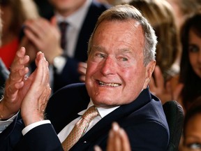 Former President George H. W. Bush appears in this file photo from July 15, 2013.  REUTERS/Kevin Lamarque/Files