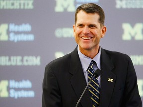 Jim Harbaugh speaks to the media as he is introduced as the new head coach of the Michigan Wolverines at Jonge Center. (Rick Osentoski/USA TODAY Sports)