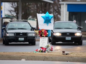 A memorial for Antonio Martin, an armed 18-year old black teen who was fatally shot by police in Berkeley, Missouri, December 24, 2014. REUTERS/Kate Munsch