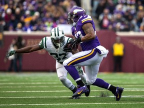 Minnesota Vikings running back Ben Tate (33) is tackled by New York Jets safety Jaiquawn Jarrett (37) during the fourth quarter at TCF Bank Stadium. The Vikings defeated the Jets 30-24 in overtime.(Brace Hemmelgarn-USA TODAY Sports)
