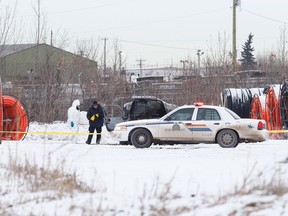 Strathcona RCMP investigate a suspicious death at a pipe yard near 84th Avenue and 34th Street in Strathcona County, Alta., on Tuesday, Dec. 30, 2014. The medical examiner attended the scene and removed a body. Ian Kucerak/Edmonton Sun/ QMI Agency