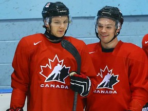 Sam Reinhart (left) jokes with Max Domi during the Canadian world junior team selection camp at the MasterCard Centre in Toronto Friday December 12, 2014. (Dave Abel/Toronto Sun/QMI Agency)