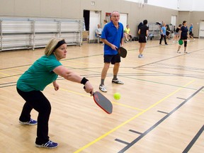 Vicki Carruthers and Doug Pitt enjoy a game of ?pickle ball? at the Carling Heights Community Centre in London. Pickle ball is one of the many activities Londoners can take part in through Spectrum programs.