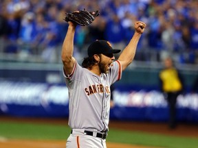 Madison Bumgarner of the San Francisco Giants celebrates after defeating the Kansas City Royals to win Game 7 of the 2014 World Seriesat Kauffman Stadium on October 29, 2014. (Elsa/Getty Images/AFP)