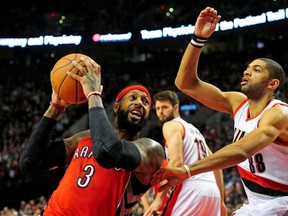 Toronto Raptors forward James Johnson drives to the basket against Portland Trail Blazers forward Nicolas Batum during the second quarter of the game at the Moda Center at the Rose Quarter on Dec. 30, 2014. (Steve Dykes/USA TODAY Sports)