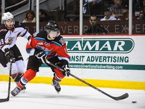 Rourke Chartier (14) of the Kelowna Rockets is chased by Vancouver Giants defender Joel during WHL play at the Pacific Coliseum on March 1, 2014 in Vancouver. (Derek Leung/Getty Images/AFP)