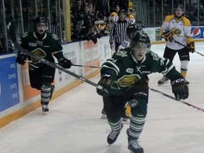 London Knights defenceman Aiden Jamieson reaches for the puck as it flies into his zone during OHL action against the Sarnia Sting on Wednesday in Sarnia. The Knights scored early and often in an 11-4 victory. (TERRY BRIDGE/THE OBSERVER)