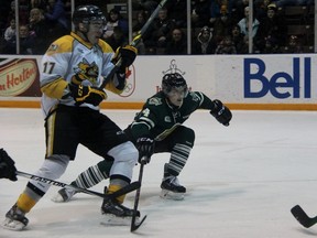 Aiden Jamieson of the London Knights tries to block Alexandre Renaud of the Sarnia Sting from getting to the net as the puck flutters to goalie Michael Giugovaz. The OHL clubs played the first of a home-and-home series Wednesday afternoon in Sarnia. (TERRY BRIDGE/THE OBSERVER)
