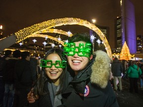 Zhuoyi Wang (left) and Jiacheng Wang sport their 2015 glasses at Nathan Phillips Square. (ERNEST DOROSZUK, Toronto Sun)