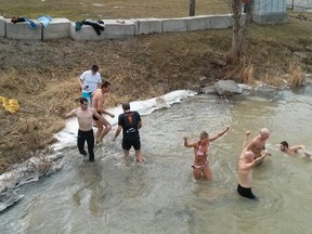 Submitted photo: Eight brave members of Wallaceburg's Defiance Running Club took a dip in the Sydenham River on New Year's Day after the club's New Year's Day run.