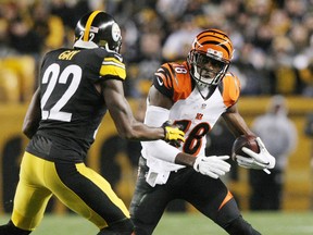 Cincinnati Bengals wide receiver A.J. Green (18) runs with the ball against Pittsburgh Steelers safety William Gay (22) in the second half at Heinz Field. The Steelers won the game, 27-17. (Jason Bridge-USA TODAY Sports)