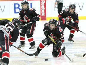 Michael Drost of the Nepean Raiders Major Atom AA protects the puck during the first period of Thursday's Bell Capital Cup championship game against the Ottawa Valley Silver Seven. (Chris Hofley/Ottawa Sun)