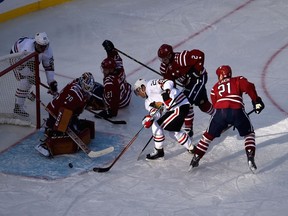 Braden Holtby #70 of the Washington Capitals makes the save on the shot by Kris Versteeg #23 of the Chicago Blackhawks during the second period of the 2015 NHL Winter Classic at Nationals Park on January 1, 2015 in Washington, DC.  (Patrick Smith/Getty Images/AFP)