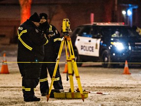 Police are on scene after a vehicle struck a pedestrian near 82 Avenue and 101 Street in Edmonton, Alta., on Thursday, Jan. 1, 2015. One person was taken to hospital in critical condition. Codie McLachlan/Edmonton Sun/QMI Agency