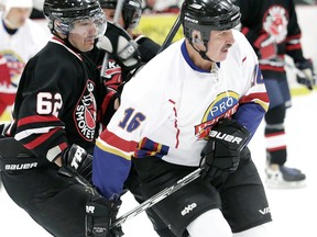 Ken Houston, right, played nine seasons in the NHL after skating for the Dresden Jr. Kings and Chatham Jr. Maroons. (Chatham Daily News File Photo)