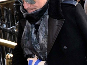 Bono arrives at the Cliff Townhouse restaurant in Dublin, Ireland, on Dec. 24, 2014. (WENN.com)