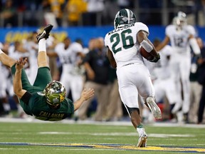Michigan State Spartans safety RJ Williamson (26) returns a block field goal attempt as Baylor Bears place kicker Chris Callahan (40) is blocked in the fourth quarter in the 2015 Cotton Bowl Classic at AT&T Stadium. Michigan State beat Baylor 42-41. (Tim Heitman-USA TODAY Sports)