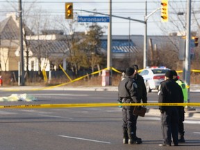 A pedestrian was struck and killed at the intersection of Hurontario St. and Derry Rd. in Mississauga Friday morning. (CHRIS DOUCETTE/Toronto Sun)