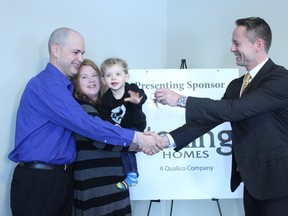 Sean and Amanda Arsenault, along with their one-year-old son Devon, accepted the keys to their new home in Stony Plain on Dec. 18. The home, built by Sterling Homes in partnership with Qualico, was given to them by Habitat for Humanity Edmonton. They were excited to receive this miracle gift just in time for the holiday season. - Karen Haynes, Reporter/Examiner