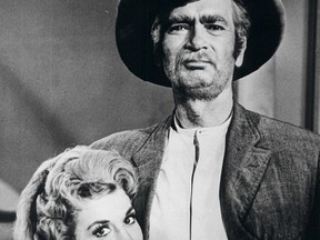 "Beverly Hillbillies" star Donna Douglas is shown in this undated publicity photograph from the series with co-star Buddy Ebsen.