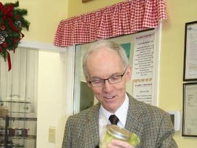NDP leadership candidate Steve Ashton (MLA for Thompson) announced his pledge to focus on local foods, including having a minister responsible for the issue, at  Local Meats and Frozen Treats (a local family-run business in St. Vital) on Jan. 2, 2015. In this photo, he's examining a jar of locally produced jam sold at the store.