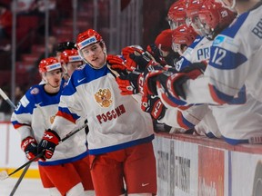 Ivan Barbashev #22 of Team Russia celebrates his goal with teammates on the bench in a quarterfinal round during the 2015 IIHF World Junior Hockey Championships against Team United States at the Bell Centre on January 2, 2015 in Montreal, Quebec, Canada.   (Minas Panagiotakis/Getty Images/AFP)