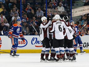 Apr 8, 2014; Edmonton, Alberta, CAN; The Colorado Avalanche celebrate a third period goal by defensemen Tyson Barrie (4) against the Edmonton Oilers at Rexall Place. Mandatory Credit: Perry Nelson-USA TODAY Sports