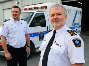 Hastings-Quinte Paramedic Services Acting Chief John O'Donnell, foreground, and Deputy Chief Carl Bowker stand outside their headquarters in Belleville, Ont. Tuesday, Dec. 30, 2014. They're overseeing a pilot program involving paramedic home visits for patients. 
Luke Hendry/The Intelligencer