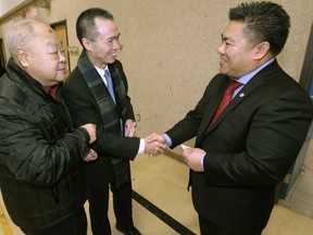From left:  Dr. Joseph Du, with Zhong Laizhao, of the Chengdu Municipal Foreign Affairs Office, and Deputy Mayor Mike Pagtakhan at the Winnipeg Chinese Cultural Community Centre.