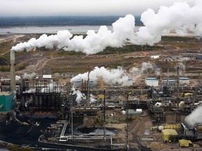 The processing facility at the Suncor tarsands operations is seen near Fort McMurray, Alta., a city that has long drawn thousands of workers to a region that produces more crude than anywhere else in the Western Hemisphere. But a slide in oil prices since June has fuelled a sense of unease in the community of nearly 73,000 that for over a decade has rarely known anything but the good times. (Todd Korol/Reuters)