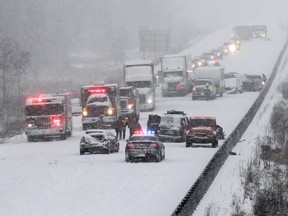 Kingston and area tow truck drivers were kept busy New Year's Day after snow squalls led to multi-vehicle collisions along Hwy. 401 between Odessa and Kingston. (Julia McKay/The Whig-Standard)
