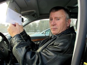 John Squarebriggs sits in his truck while showing an envelop that contained $1,150 that he lost this week which was for the purchase of a new hearing aid. (Paul Schliesmann/The Whig-Standard)