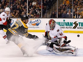 Patrice Bergeron #37 of the Boston Bruins scores by Craig Anderson #41 of the Ottawa Senators in the 1st period at TD Garden on February 8, 2014 in Boston, Massachusetts.  Jim Rogash/Getty Images/AFP