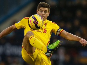 Liverpool's Steven Gerrard controls the ball during their English Premier League soccer match against Burnley at Turf Moor in Burnley, northern England December 26, 2014. (REUTERS)