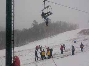 Rescuers use ropes to lower skiers to the ground yesterday after the Vanier Express chairlift broke down at the Mont Ste.Marie ski resort in the Gatineau Mountains. Griffith Slaughter/Submitted photo