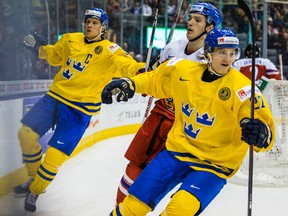 Sweden's Jacob de la Rose and Anton Karlsson celebrate a goal against the Czech Republic during the IIHF World Junior Championship at the Air Canada Centre on December 26, 2014. (Ernest Doroszuk/Toronto Sun/QMI Agency)